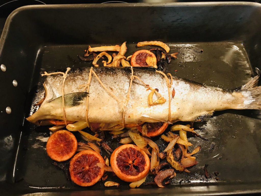 Cooked salmon in a roasting pan